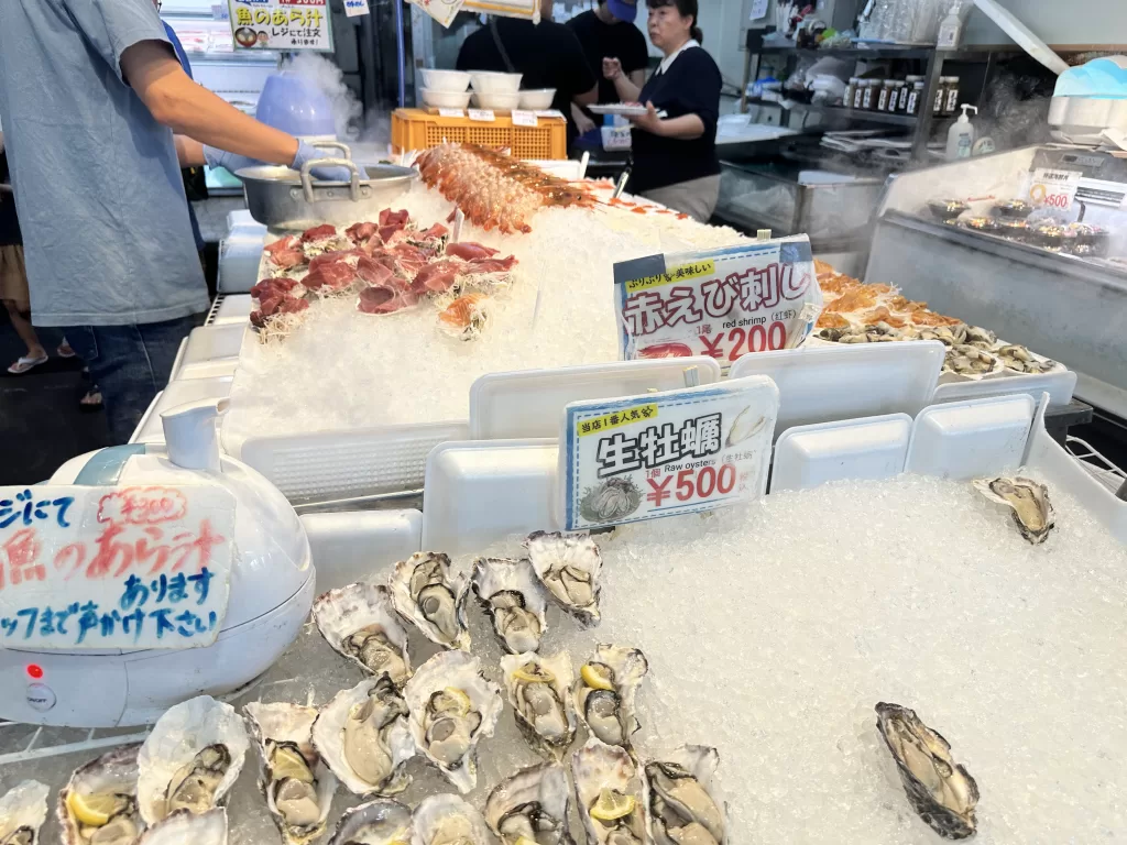 Raw oysters on ice at 500 yen each and red shrimp sashimi at 200 yen