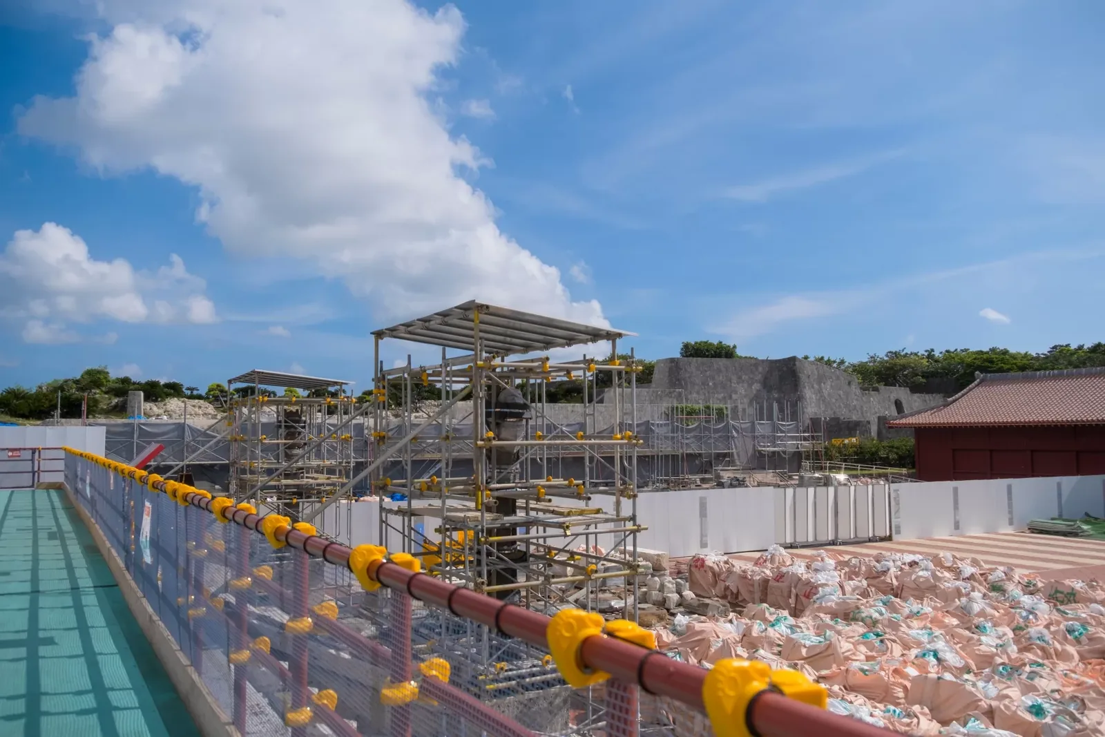 Scaffolding and stacked stone at the Shuri Castle reconstruction site