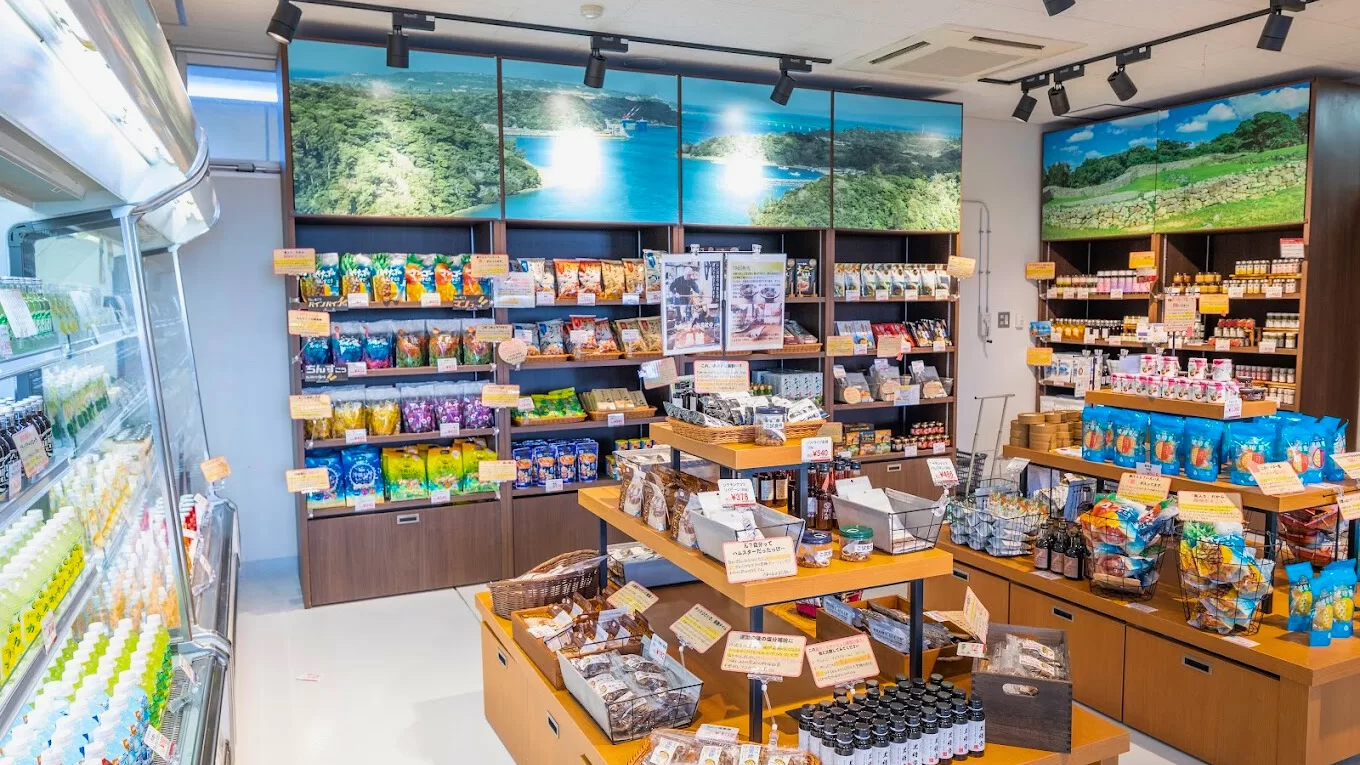 The AMESOKO store interior with local products and photo panels of Nakijin Castle